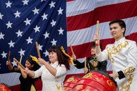 A Vietnamese dance troupe performs during the 50th anniversary of Operation Frequent Wind